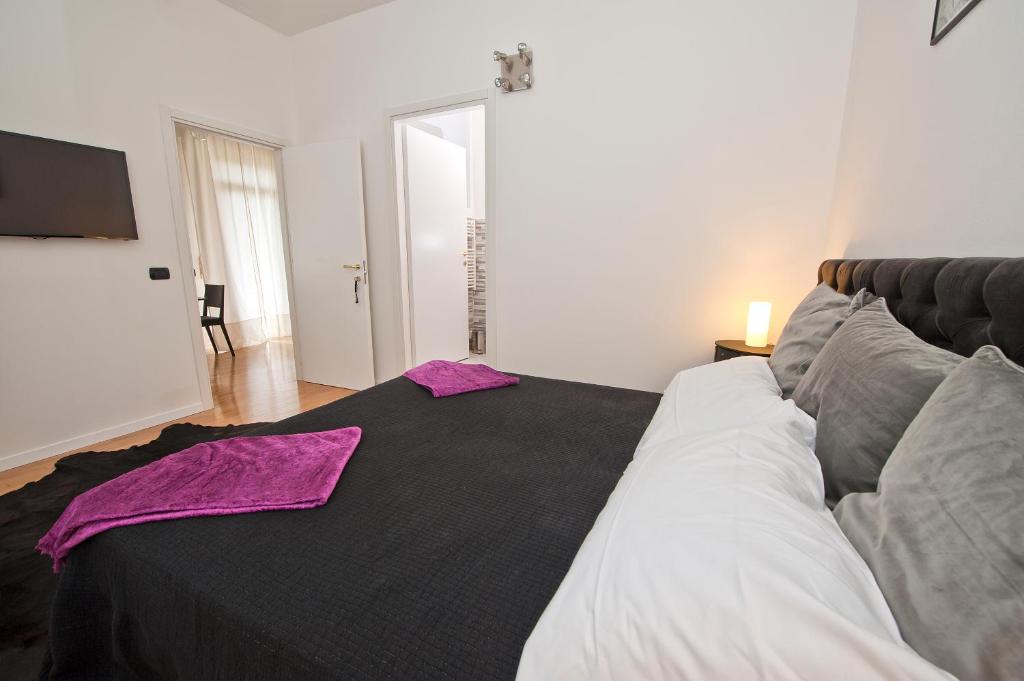 Postel nebo postele na pokoji v ubytování Verona Maison