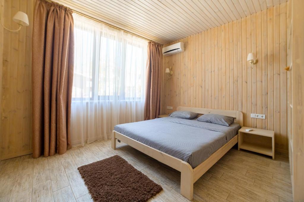 Postel nebo postele na pokoji v ubytování Prichal 80 Hotel