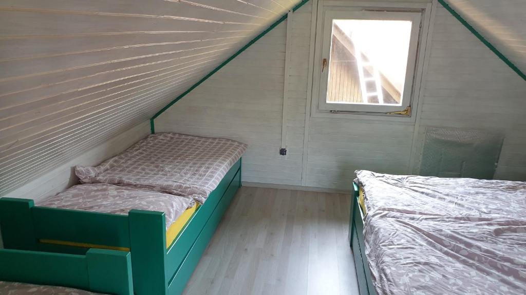 Кровать или кровати в номере Apartmaji sanje