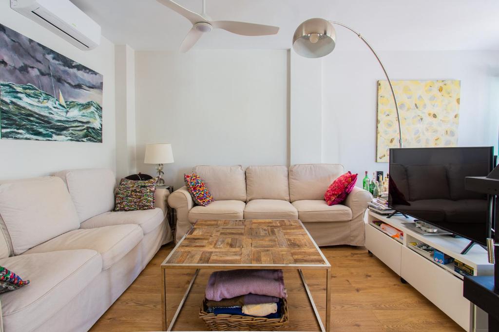 a living room with a couch and a coffee table at CASA CON ENCANTO in Cabo de Palos
