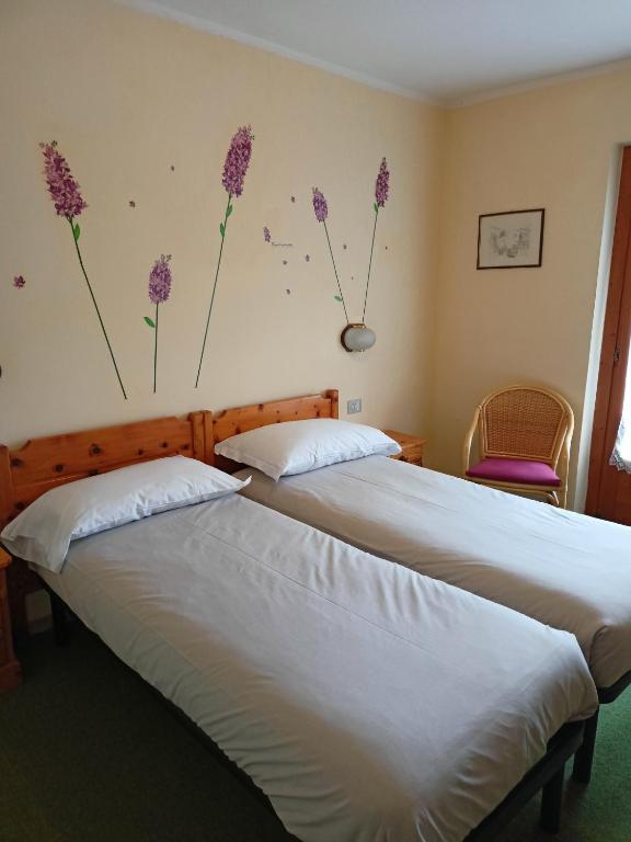 Postel nebo postele na pokoji v ubytování Hotel Daniela