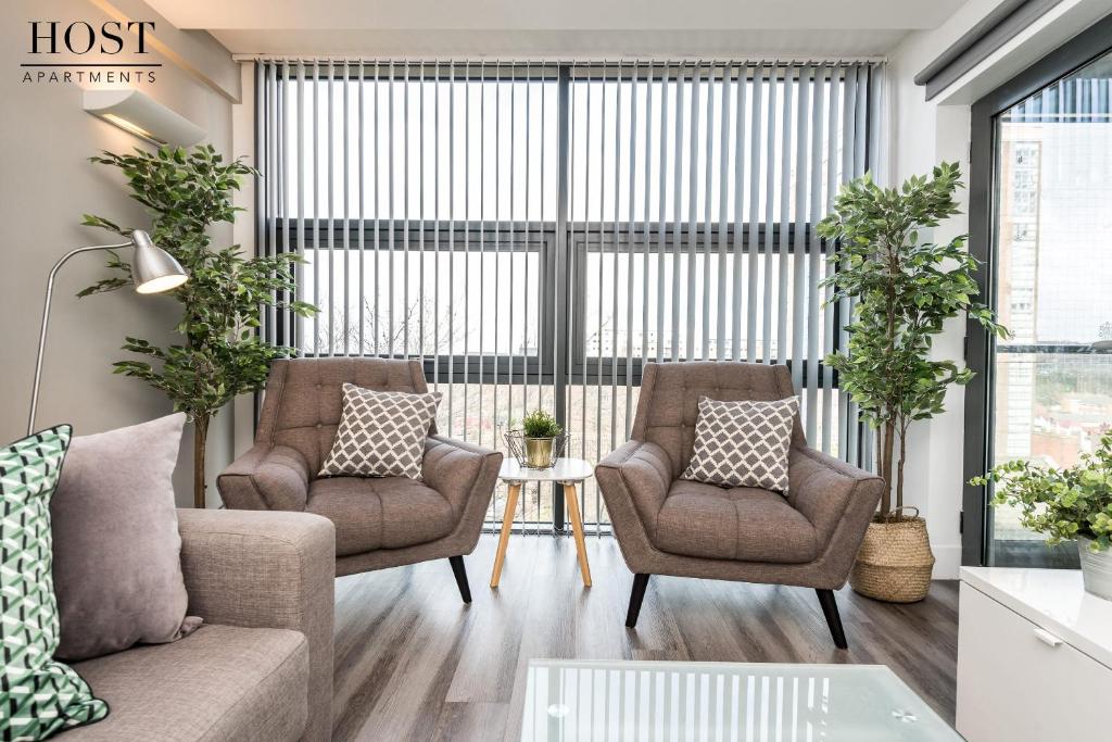 a living room with two chairs and a couch at Host & Stay - Standish Street Place in Liverpool