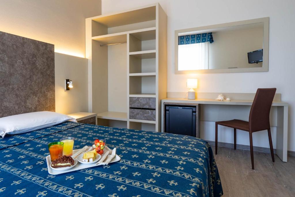Postel nebo postele na pokoji v ubytování Hotel Ca' D'Oro