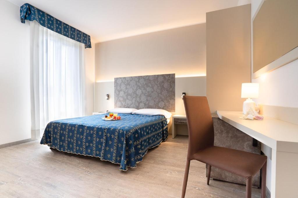 Postel nebo postele na pokoji v ubytování Hotel Ca' D'Oro