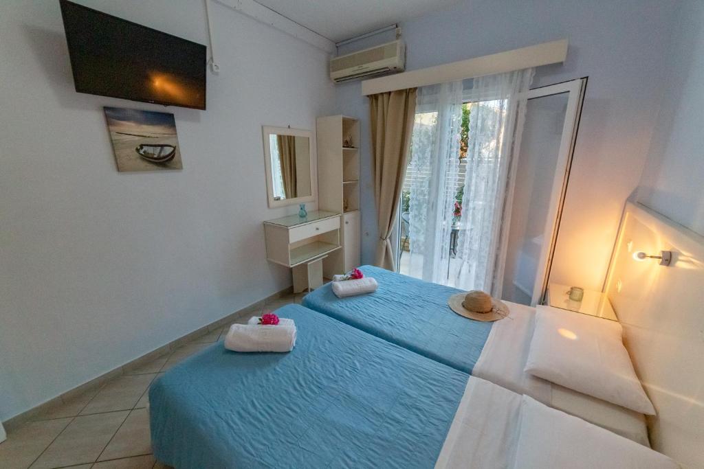 Postel nebo postele na pokoji v ubytování Angelina Apartments