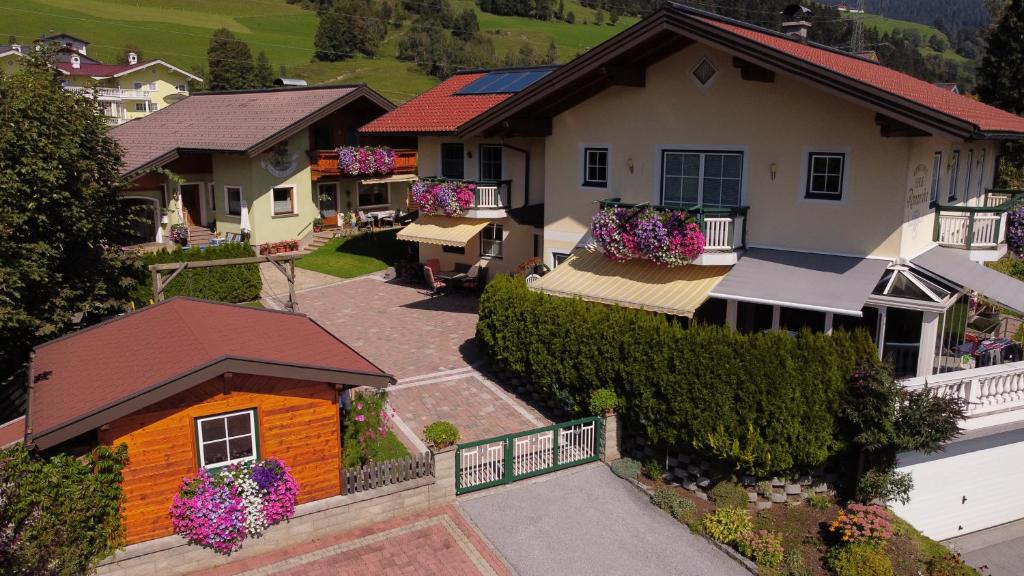 an overhead view of a house with flowers in the yard at Appartements Romantika & Appartement Barbara in Wagrain