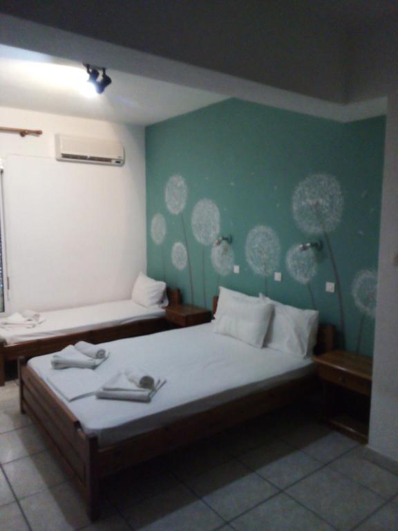 Postel nebo postele na pokoji v ubytování Alexandra rooms