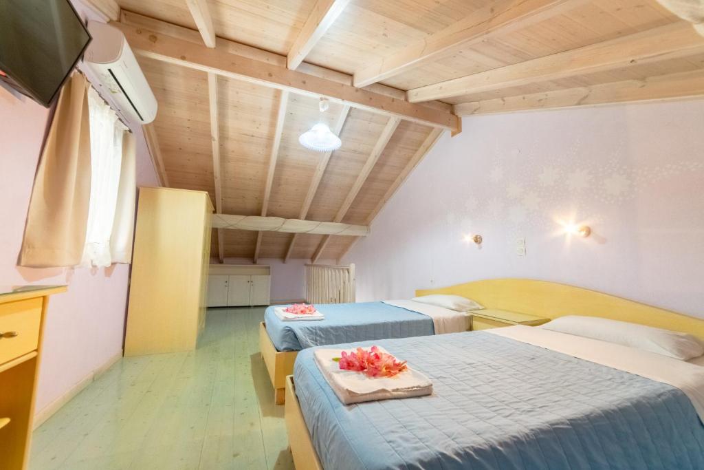 Postel nebo postele na pokoji v ubytování Angelina Apartments