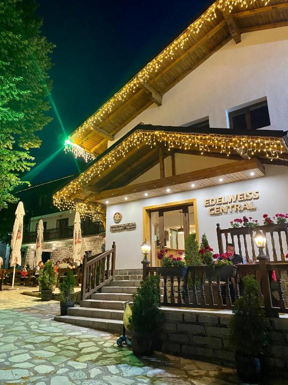 a building with stairs and lights on it at Edelweiss Central Hotel in Bansko