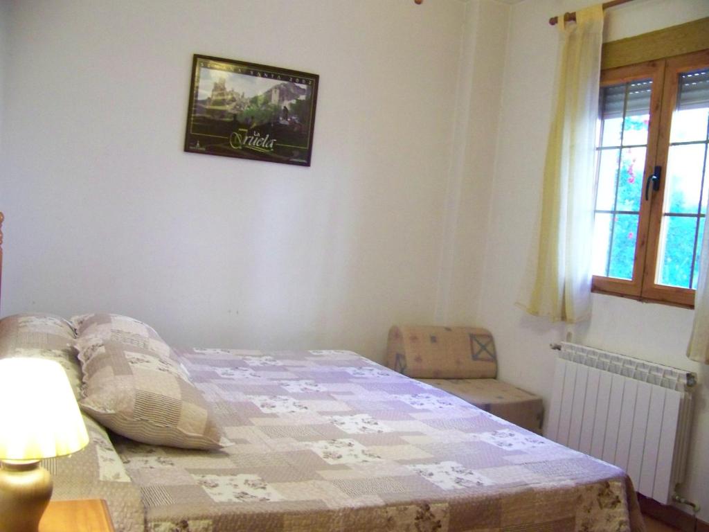 Postel nebo postele na pokoji v ubytování Apartamentos La Iruela 2