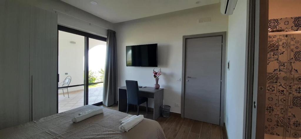Televízia a/alebo spoločenská miestnosť v ubytovaní Qvattro stagioni panoramic suites