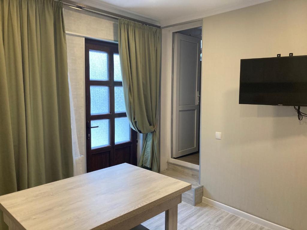 TV a/nebo společenská místnost v ubytování Nikas Guest House
