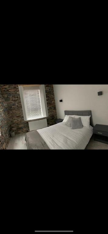 Postel nebo postele na pokoji v ubytování Lisvarna House
