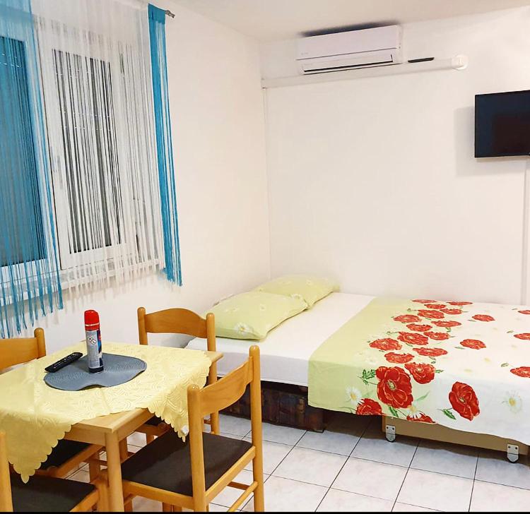 Postel nebo postele na pokoji v ubytování Guesthouse Pejo