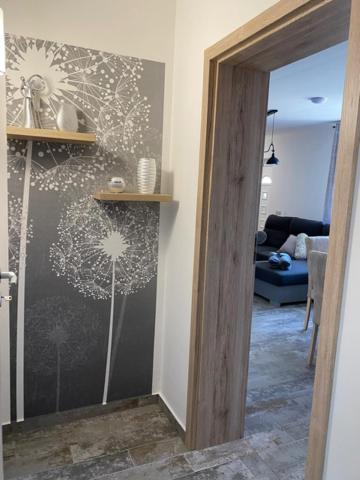 Postel nebo postele na pokoji v ubytování Dióliget Cottage Sárvár