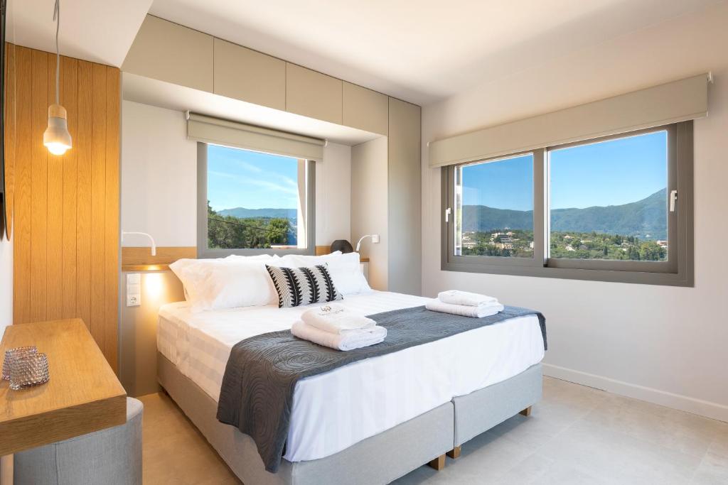 Uma cama ou camas num quarto em Onore Luxury Suites