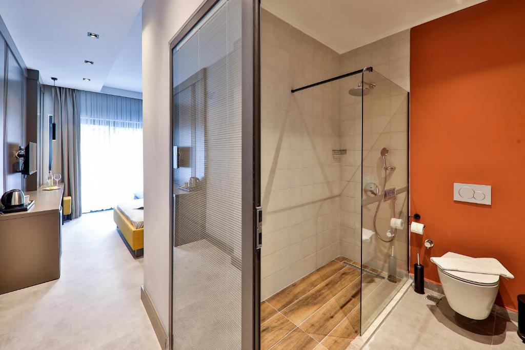 a bathroom with a shower and a toilet at Neva Kaş in Kaş