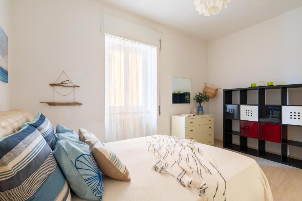 Łóżko lub łóżka w pokoju w obiekcie Noi 2 Vacanze al Mare - ARGENTARIO