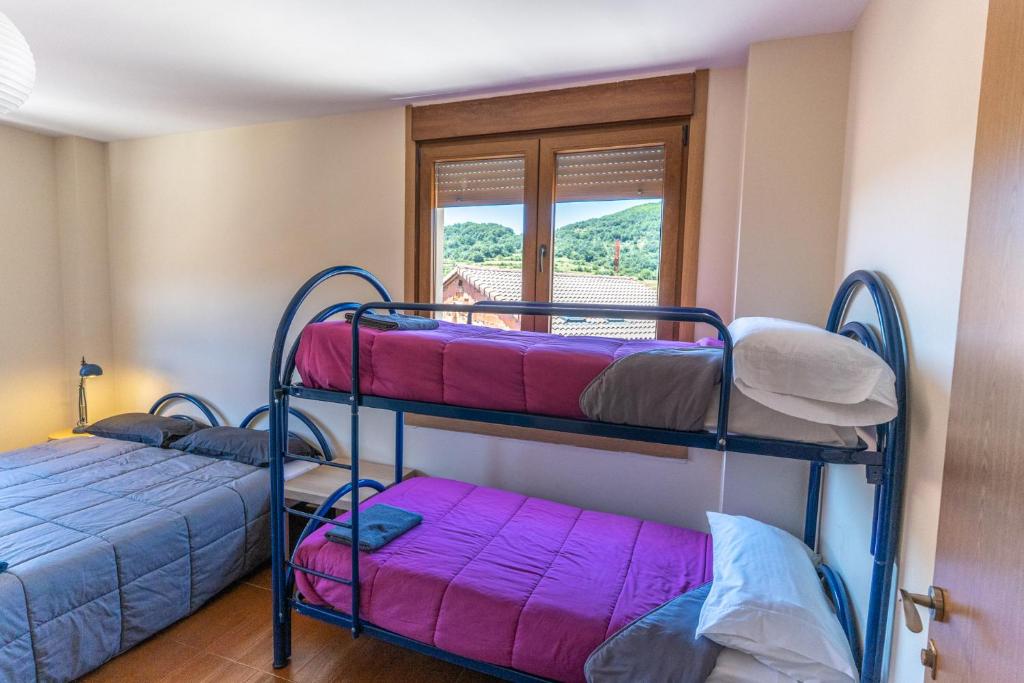 Postel nebo postele na pokoji v ubytování Albergue de Prioro