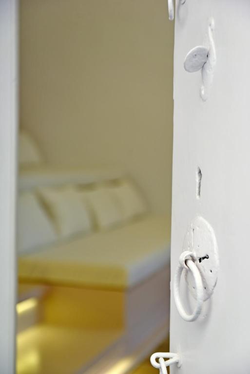 Postel nebo postele na pokoji v ubytování Hydra Hospitality Port Apartment