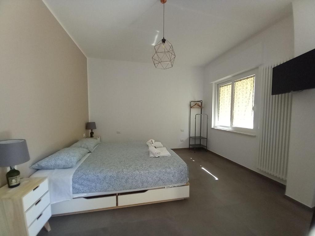 Posteľ alebo postele v izbe v ubytovaní AMARE MATERA comfortable rooms