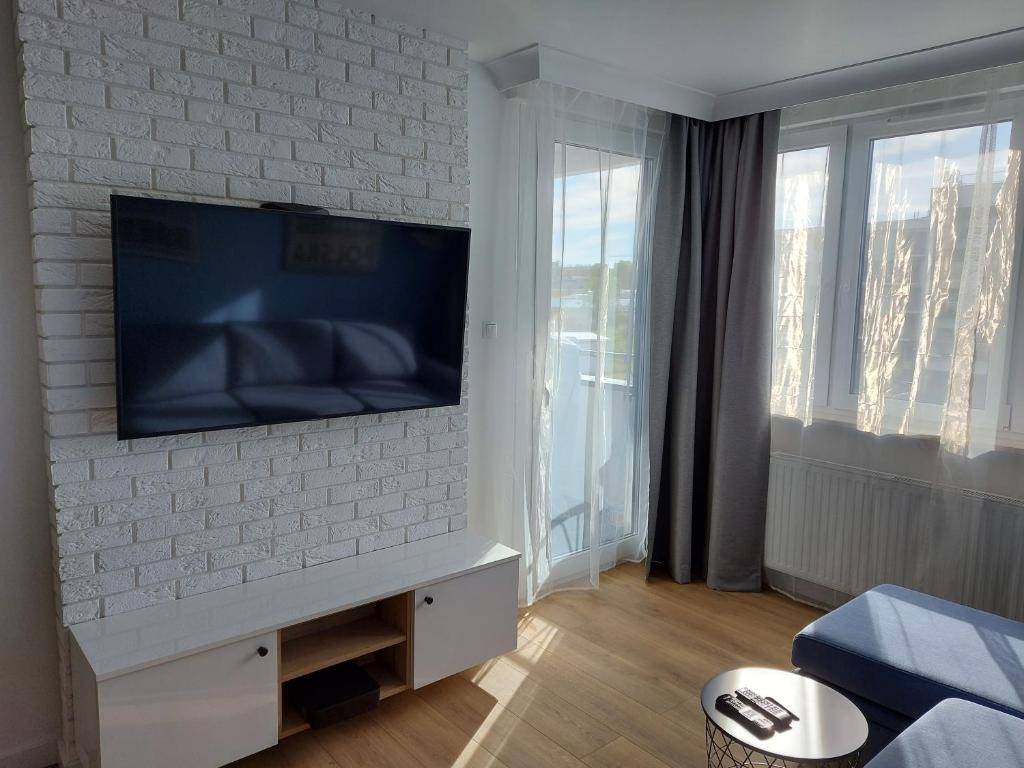 Televízia a/alebo spoločenská miestnosť v ubytovaní Baltic Blue Apartament
