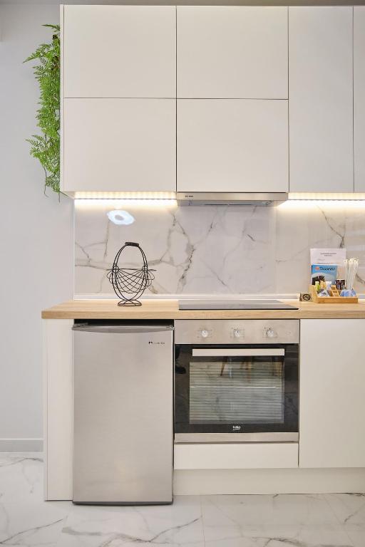 Kuchyň nebo kuchyňský kout v ubytování Elegant Central Apartment Veria - με ενδοδαπέδια θέρμανση!!!
