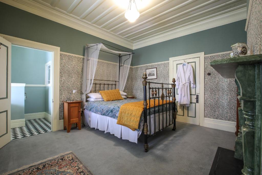Postel nebo postele na pokoji v ubytování Dunstan House