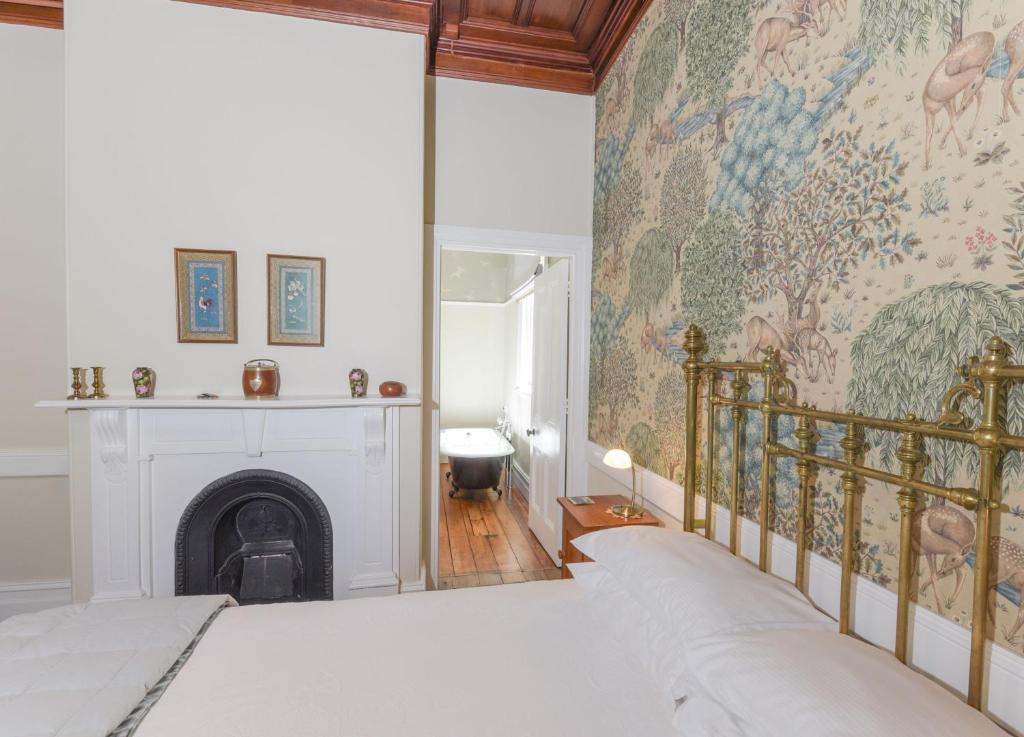 Postel nebo postele na pokoji v ubytování Dunstan House