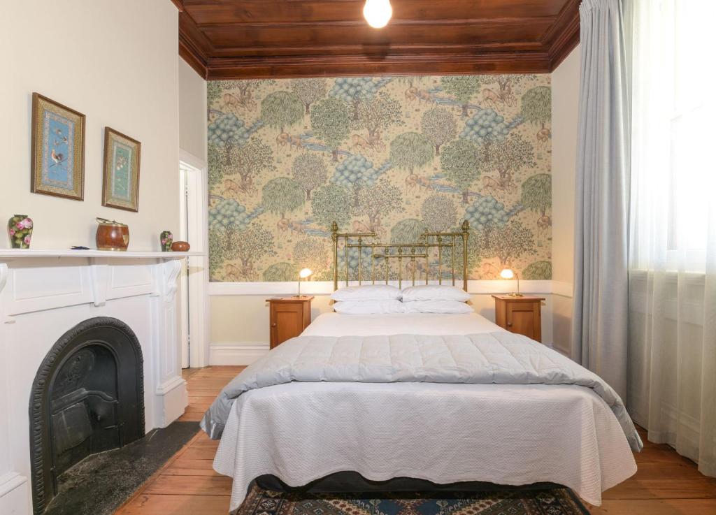 Postel nebo postele na pokoji v ubytování Dunstan House