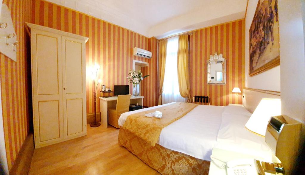 Postel nebo postele na pokoji v ubytování Hotel Corte dei Greci