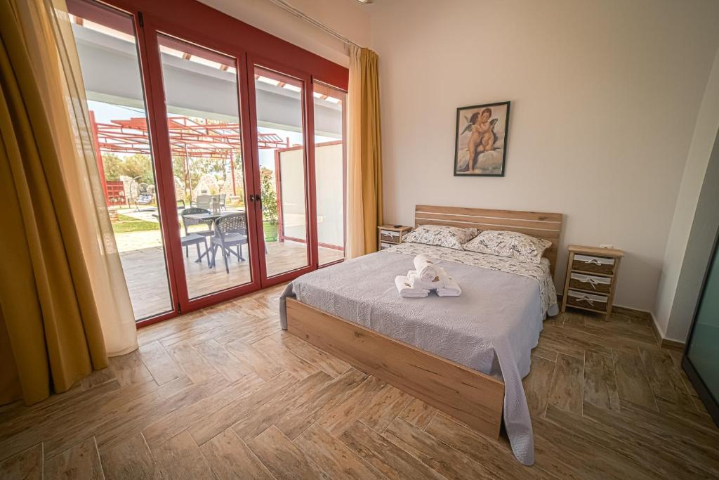 Postel nebo postele na pokoji v ubytování Olive Tree Suites