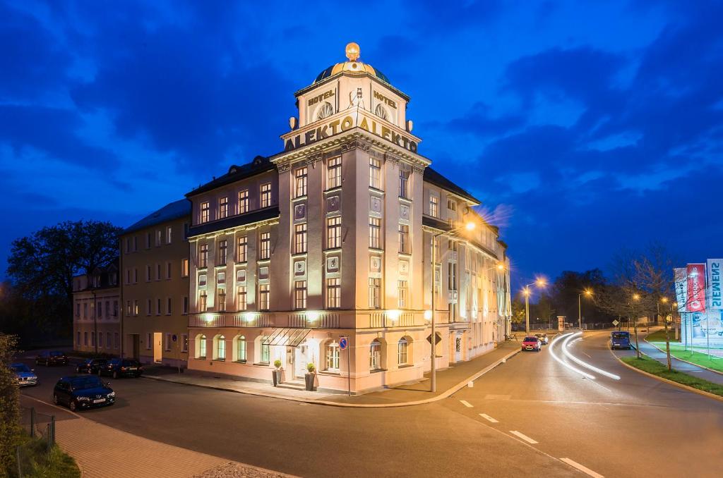 a large building with a clock tower on top of it at Hotel Alekto in Freiberg