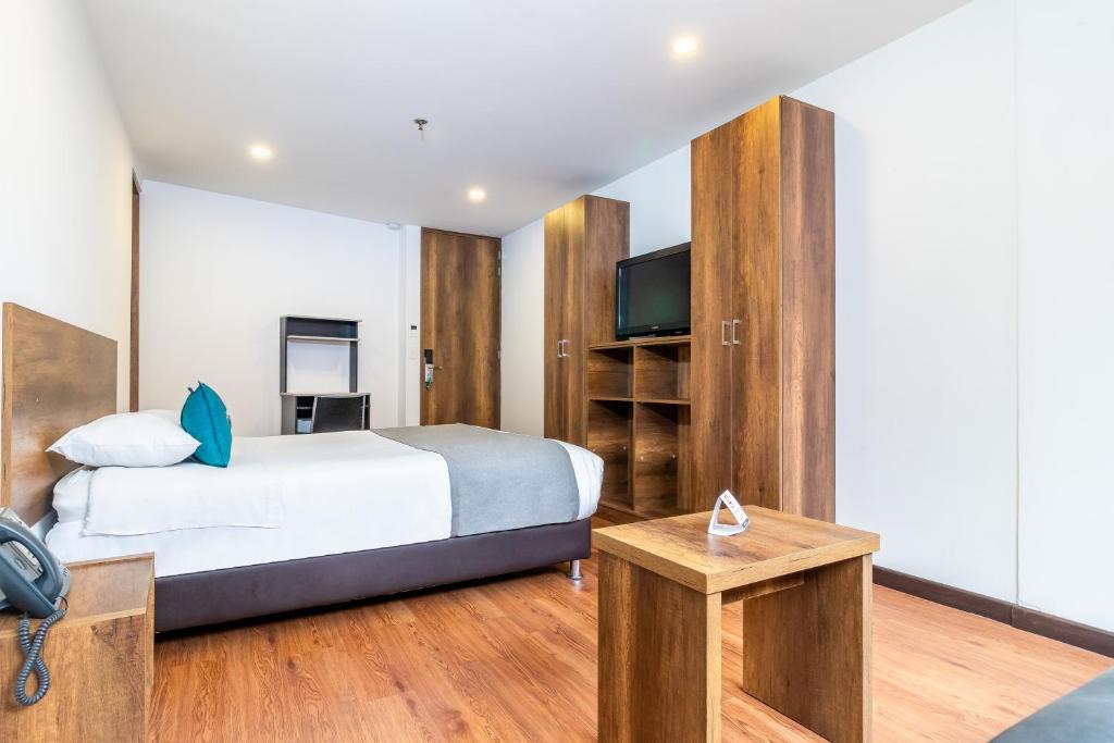 Postel nebo postele na pokoji v ubytování Hotel Black Usaquen