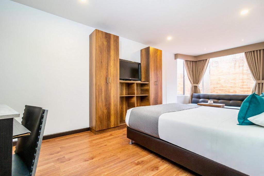 Postel nebo postele na pokoji v ubytování Hotel Black Usaquen
