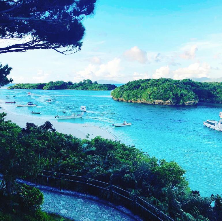 a view of a river with boats in the water at Joya in Ishigaki Island