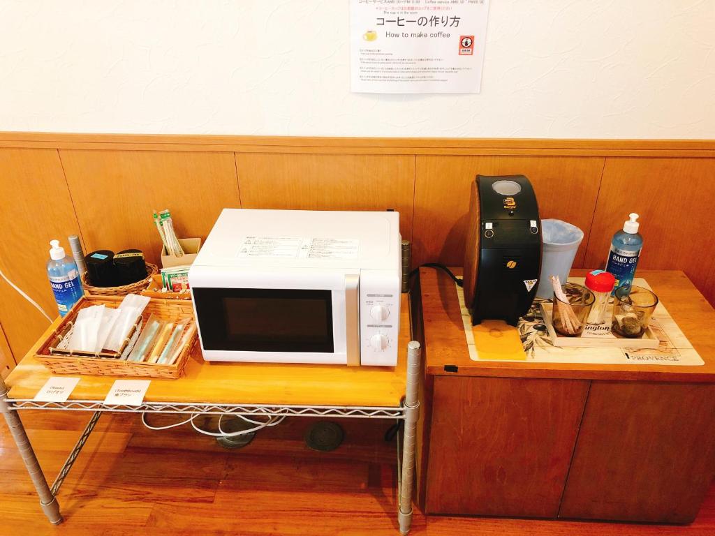 a microwave sitting on top of a table at Joya in Ishigaki Island