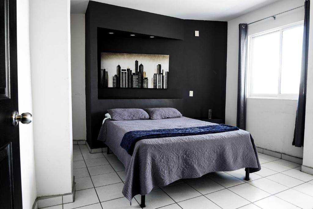Postel nebo postele na pokoji v ubytování Hotel San Luis