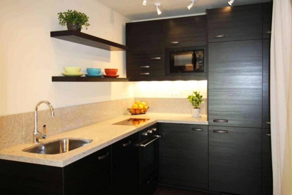 A kitchen or kitchenette at Peaceful Designer Home 50 meters from Lake Balaton, Ideal for Families