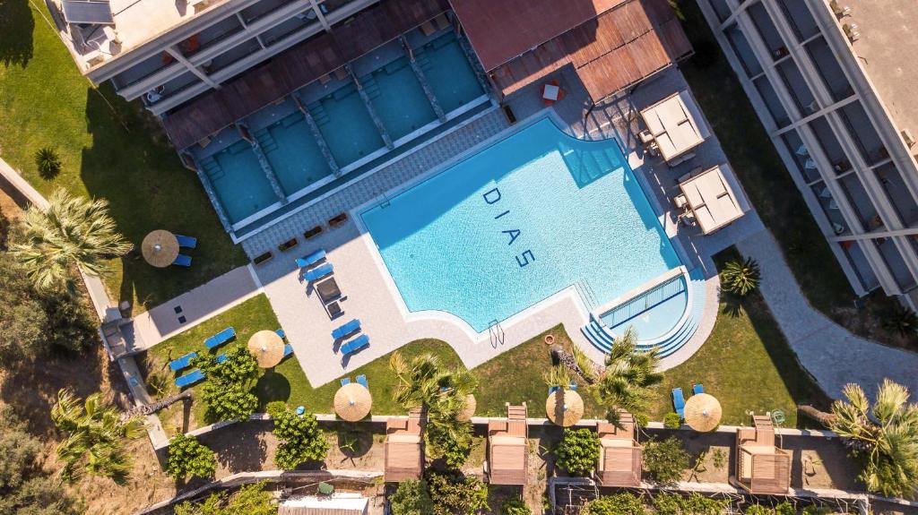 an overhead view of a swimming pool in a resort at Dias Studios & Suites in Faliraki