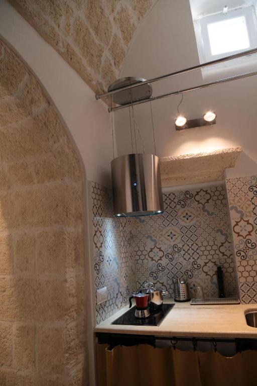 Kuchyň nebo kuchyňský kout v ubytování Chianca d l'ora - White Stone Suite
