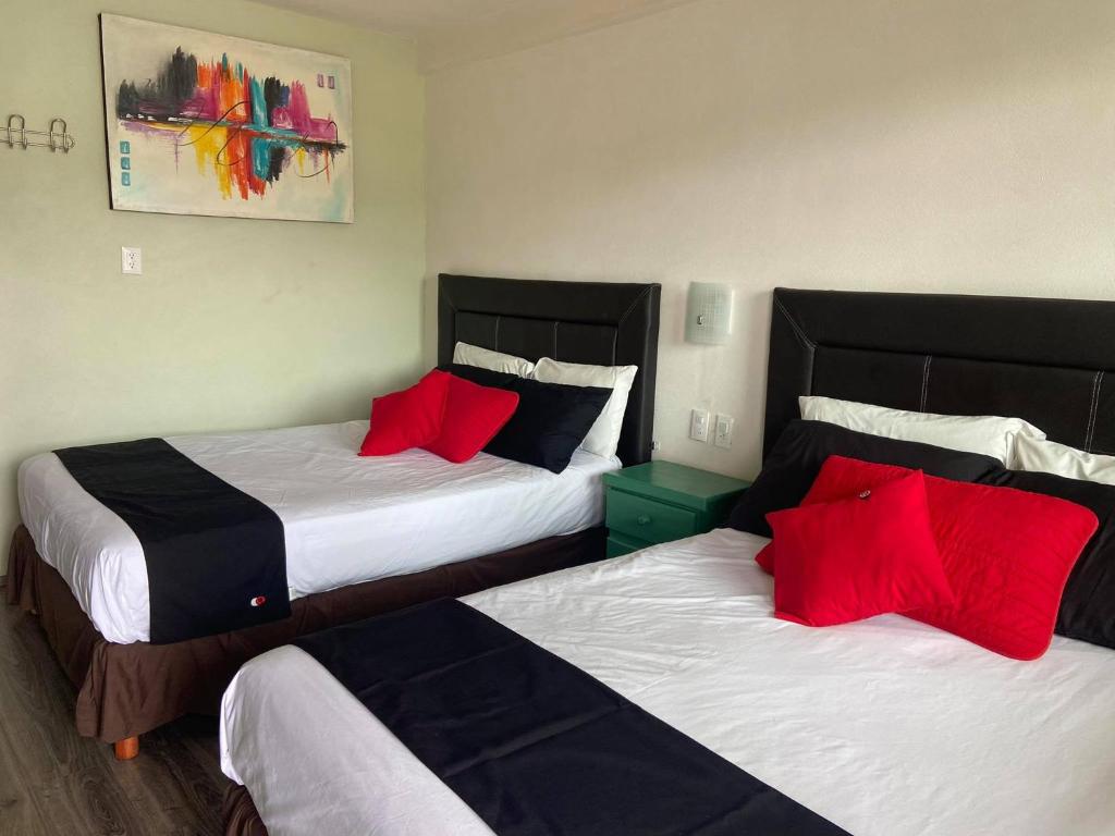 Postel nebo postele na pokoji v ubytování Vista Zacatlan Hotel