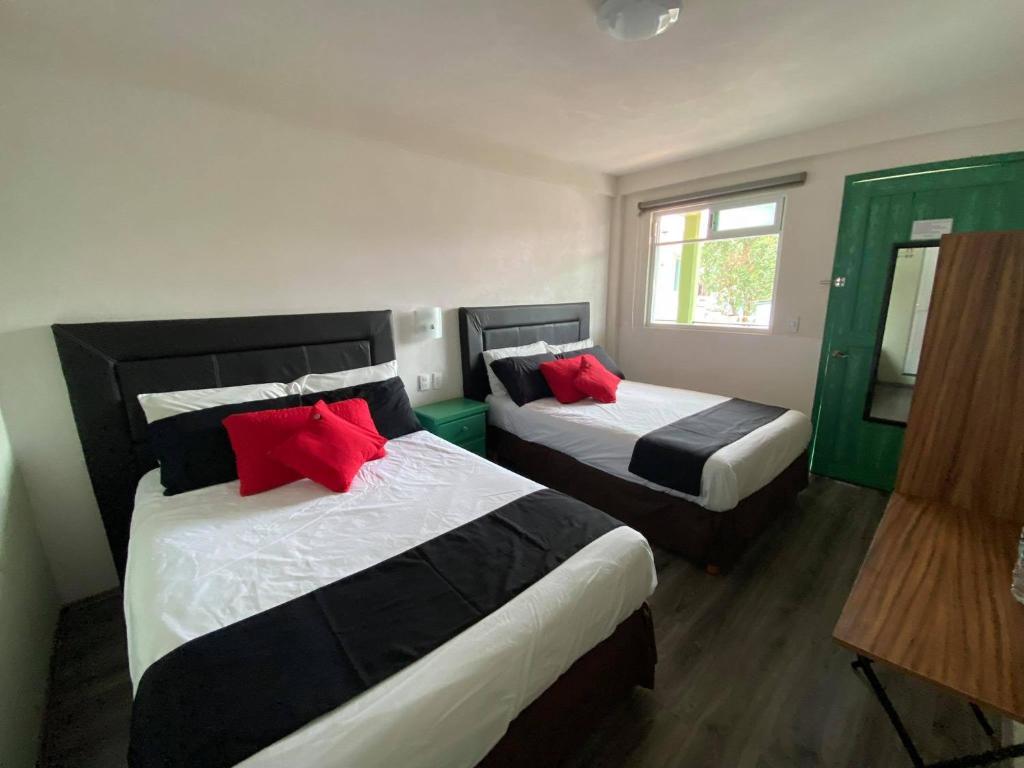 Postel nebo postele na pokoji v ubytování Vista Zacatlan Hotel