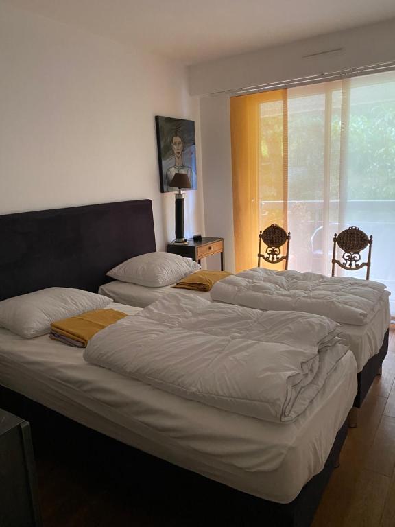 A bed or beds in a room at Appartement Monseigneur