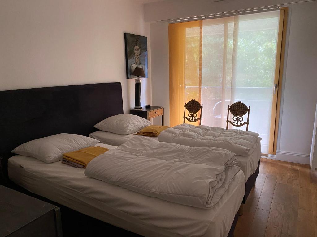 A bed or beds in a room at Appartement Monseigneur