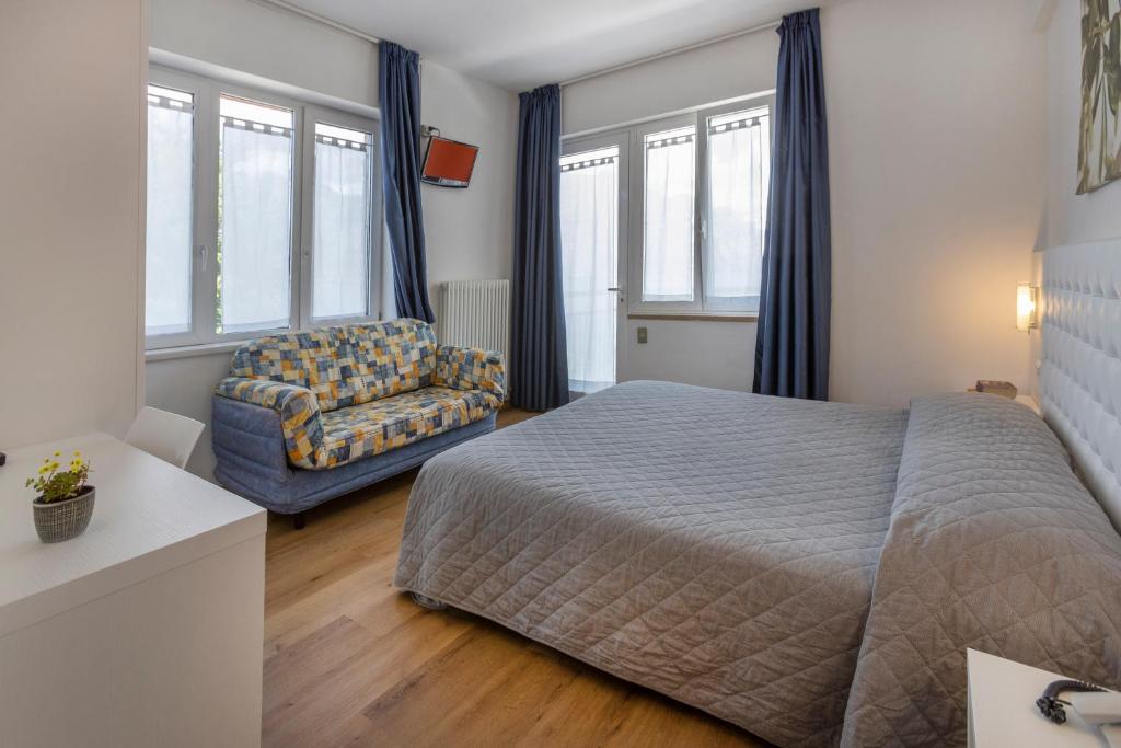 Postel nebo postele na pokoji v ubytování Hotel Al Molino