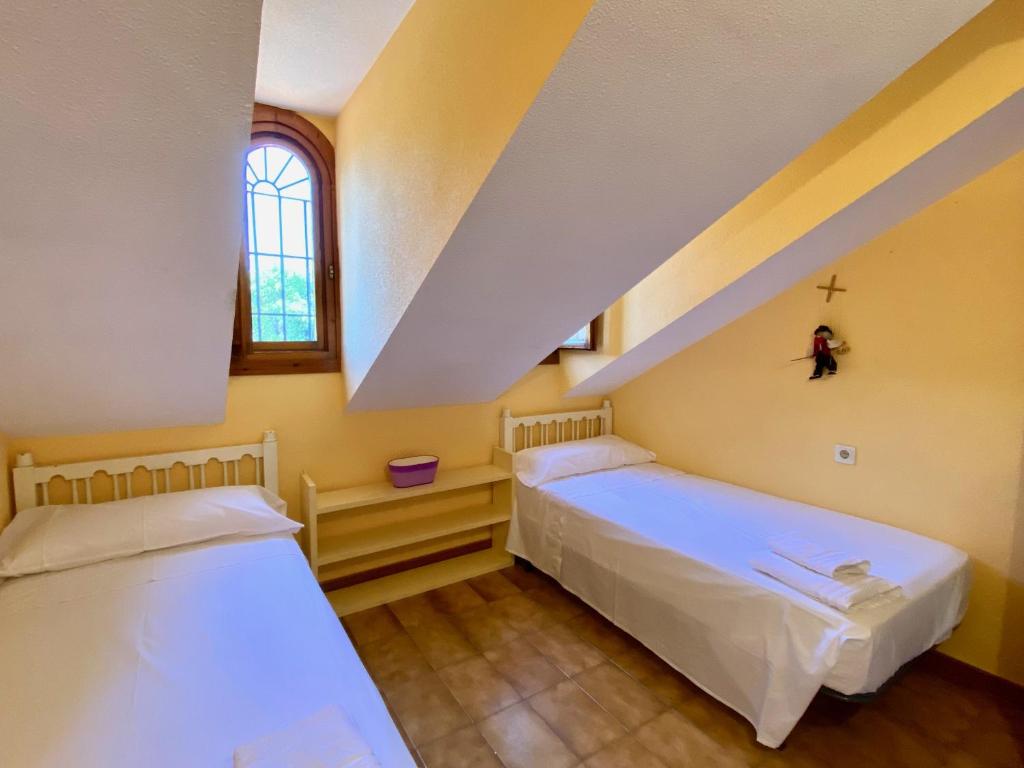 Łóżko lub łóżka w pokoju w obiekcie Precioso Chalet en Almuñecar junto al Mar con Garage privado