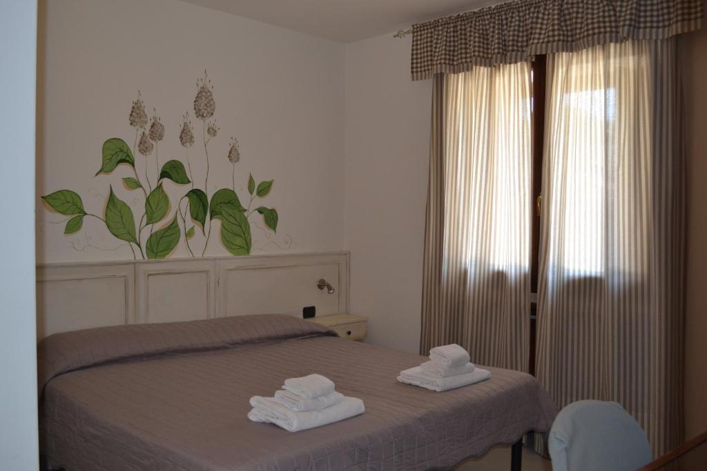 Postel nebo postele na pokoji v ubytování Albergo Grobberio