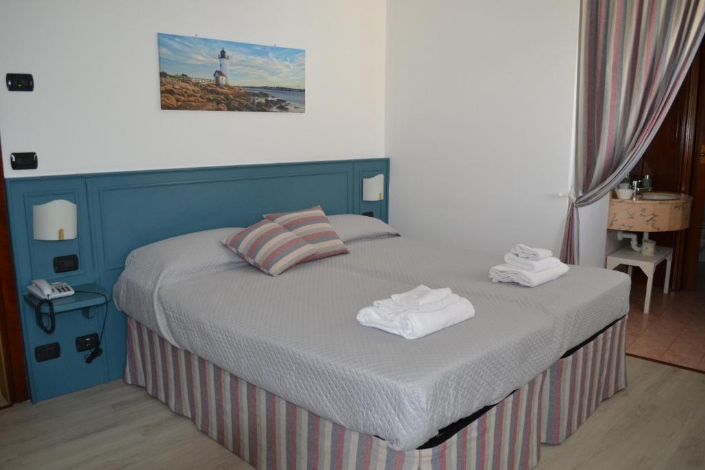 Postel nebo postele na pokoji v ubytování Albergo Grobberio