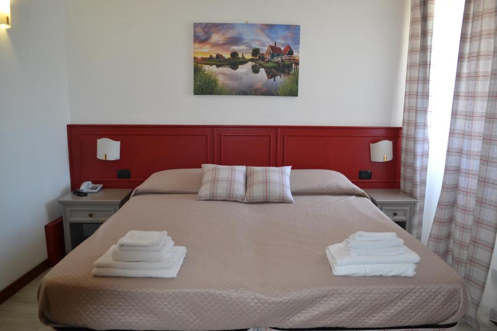 Postel nebo postele na pokoji v ubytování Albergo Grobberio